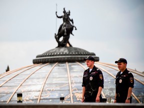 Russian police officers stand guard on Manezhnaya Square in downtown Moscow on July 13, 2018, two days before the Russia 2018 World Cup final football match between France and Croatia. (Photo by Alexander NEMENOV / AFP) (Photo credit should read ALEXANDER NEMENOV/AFP/Getty Images)