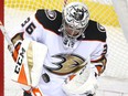 Anaheim Ducks goalie John Gibson stops a puck during a game against the Calgary Flames on March 21, 2018 at the Saddledome  in Calgary.