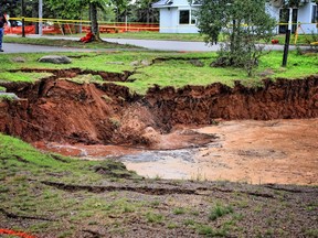 A sinkhole is shown in Oxford, N.S. on Aug.27, 2018 in a handout photo. The unpredictable sinkhole that has swallowed up trees and picnic tables in a Nova Scotia park is continuing to grow -- and has inspired a song.