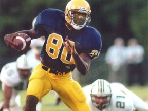 In this photo provided by the University of Tennessee Chattanooga athletic department, wide receiver Terrell Owens plays in a college football game for the school. (UTC Athletics via AP)