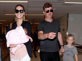 Robin Thicke, April Love Geary and their son Julian  at Los Angeles International Airport on April 6, 2018.