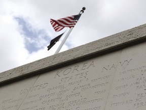 The Honolulu Memorial Korean War Courts of the Missing memorial wall is shown at the National Memorial Cemetery of the Pacific in Honolulu on Monday, July 30, 2018. (AP Photo/Caleb Jones)