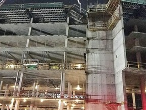 This shows the collapsed scaffolding, top center, at a hotel under construction after two workers fell to their deaths early Wednesday, Aug. 29, 2018, near Orlando, Fla. (Orange County Fire Rescue via AP)