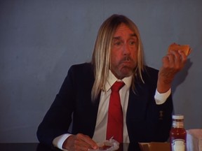 Iggy Pop eats a burger while bopping along to Death Valley Girls' new video.  (Suicide Squeeze Records/YouTube)
