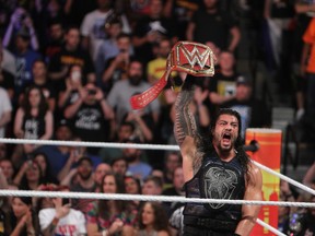 New WWE Universal Champion Roman Reigns celebrates his championship win at the Barclays Center at SummerSlam on Sunday. (GEORGE TAHINOS/SLAM! Wrestling)
