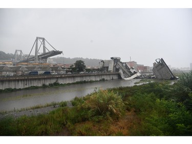 A view of the collapsed Morandi highway bridge in Genoa, northern Italy, Tuesday, Aug. 14, 2018.
