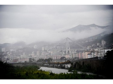 A view of the collapsed Morandi highway bridge in Genoa, northern Italy, Tuesday, Aug. 14, 2018.=