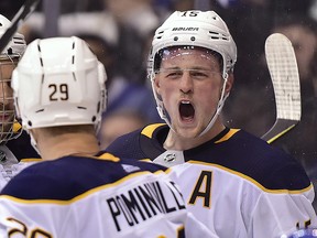 In this March 26, 2018, file photo, Buffalo Sabres centre Jack Eichel (15) celebrates his goal against the Maple Leafs in Toronto. (Frank Gunn/The Canadian Press via AP, File)
