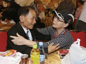 South Korean Kim Hye-ja, 75, right, meets with her North Korean younger brother Kim Eun Ha, 75, during a separated family reunion meeting at the Diamond Mountain resort in North Korea, Tuesday, Aug. 21, 2018.