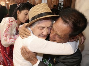 South Korean Lee Keum-seom, 92, left, weeps as she meets with her North Korean son Ri Sang Chol, 71, during the Separated Family Reunion Meeting at the Diamond Mountain resort in North Korea, Monday, Aug. 20, 2018.