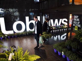 A man leaves a Loblaws store in Toronto on May 3, 2018. Loblaw Companies Limited held their annual general meeting. Loblaw Companies Ltd. says some of its President's Choice beer will sell for a loonie for a limited time to celebrate the return of buck-a-beer in the province. THE CANADIAN PRESS/Nathan Denette