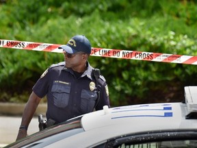 Police investigate the scene of a multiple shooting Sunday, Aug. 26, 2018, at the Jacksonville Landing in Jacksonville, Fla., during a Madden Championship Series video game tournament. A gunman opened fire Sunday during an online video game tournament that was being livestreamed, killing multiple people and sending many others to hospitals, authorities said.