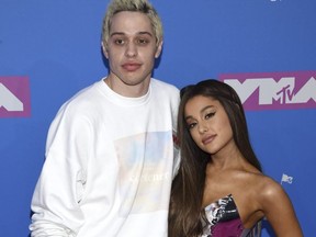 Pete Davidson, left, and Ariana Grande arrive at the MTV Video Music Awards at Radio City Music Hall on Monday, Aug. 20, 2018, in New York. (Evan Agostini/Invision/AP)