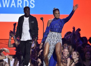 Kevin Hart, left, and Tiffany Haddish present the award best hip-hop video onstage at the MTV Video Music Awards at Radio City Music Hall on Monday, Aug. 20, 2018, in New York. (Chris Pizzello/Invision/AP)