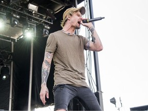 In this Sunday, May 20, 2018 file photo, Kyle Pavone of We Came As Romans performs at the Rock On The Range Music Festival in Columbus, Ohio. On Saturday, Aug. 25, 2018,