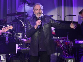 FILE - In this Feb. 11, 2017 file photo, Neil Diamond performs at the Clive Davis and The Recording Academy Pre-Grammy Gala in Beverly Hills, Calif. Diamond's latest "Hot August Night III," releases on Friday, Aug. 17.