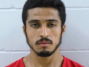 This undated photo provided by the Pierce County Jail in Elllsworth, Wis. shows Miguel Navarro, a roofer who is accused of intentionally using a circular saw to fatally injure a co-worker Monday, Aug. 6, 2018, near River Falls, Wis.