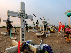 A white cross for Broncos coach Darcy Haugan at the memorial for the 16 members of the Humboldt Broncos who were killed in a bus crash near Tisdale, Sask. (Leah Hennel/Postmedia)