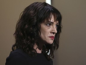 FILE - In this Saturday, May 19, 2018, file photo, actress Asia Argento speaks about being raped by Harvey Weinstein during the closing ceremony of the 71st international film festival, Cannes, southern France. The New York Times reports that Argento, one of the most prominent activists of the #MeToo movement, recently settled a lawsuit filed against her by a young actor and musician who said she sexually assaulted him when he was 17.