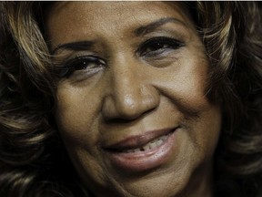 In this Feb. 11, 2011 file photo, Aretha Franklin smiles after the Detroit Pistons-Miami Heat NBA basketball game in Auburn Hills, Mich.