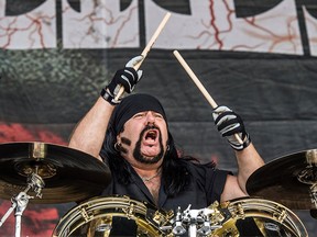 In this Oct. 1, 2016, file photo, Vinnie Paul performs at the Louder Than Life Festival in Louisville, Ky.
