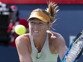 Maria Sharapova of Russia returns to Sesil Karatantcheva of Bulgaria during first round of play at the Rogers Cup tennis tournament Tuesday August 7, 2018 in Montreal. THE CANADIAN PRESS/Paul Chiasson