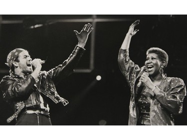 - In this Aug. 30, 1988 file photo, Aretha Franklin joins George Michael during his Faith World Tour in Auburn Hills, Mich.