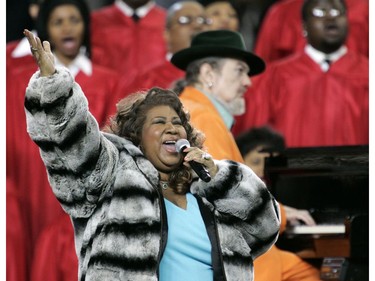 In this Feb. 5, 2006 file photo, Aretha Franklin and Dr. John, background on piano, perform the national anthem before the Super Bowl XL football game in Detroit.