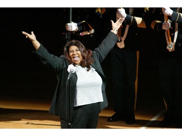 In this June 15, 2004 file photo, singer Aretha Franklin sings the National Anthem before the start of game 5 of the NBA Finals between the Detroit Pistons and the Los Angeles Lakers in Auburn Hills, Mich.