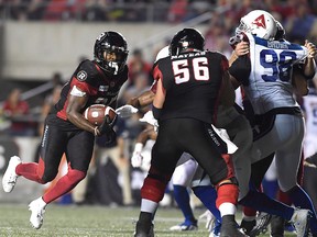 Ottawa Redblacks' William Powell runs before making a touchdown during second half CFL action against the Montreal Alouettes, in Ottawa on Saturday, Aug. 11, 2018.