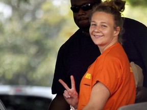 Reality Winner, who pleaded guilty to mailing a classified U.S. report to a news organization, walks out of a courthouse in Augusta, Ga., Thursday, Aug. 23, 2018. (Michael Holahan/The Augusta Chronicle via AP)