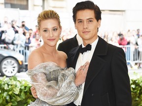 Lili Reinhart and Cole Sprouse attend the Heavenly Bodies: Fashion & The Catholic Imagination Costume Institute Gala at The Metropolitan Museum of Art on May 7, 2018 in New York City.