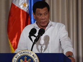 Philippine President Rodrigo Duterte delivers a speech during the presentation ceremony of the signed document on the Organic Law for Bangsamoro Autonomous Region of Muslim Mindanao to officials of the Moro Islamic Liberation Front at Malacanang Palace in Manila on Monday, Aug. 6, 2018.