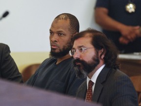 Siraj Ibn Wahhaj, left, sits next to public defence attorney Aleks Kostich at a first appearance in New Mexico state district court in Taos, N.M., Wednesday, Aug. 8, 2018, on accusations of child abuse and abducting his son from the boy's mother.