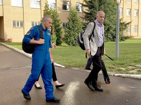 Canadian astronaut David Saint-Jacques heads back to his quarters at end of the day of training at the Gagarin Cosmonaut Training Center in Star City, Russia, on Thursday, Aug. 16, 2018.