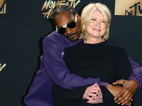 Snoop Dogg, left, and Martha Stewart pose in the press room during the 2017 MTV Movie and TV Awards at the Shrine Auditorium, in Los Angeles, California, on May 7, 2017.  (JEAN-BAPTISTE LACROIX/AFP/Getty Images)