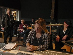 Randy Rampage (left) in a 2008 recording session with DOA and producer Bob Rock (at board). DOA's Joe Keithley is beside Rampage.