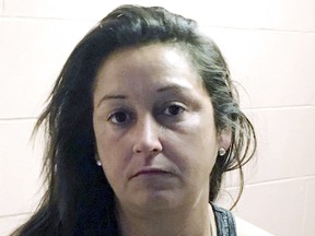 This booking photograph released Thursday, Aug. 30, 2018, by the New Hampshire Attorney General's Office shows Catrina Costello, arrested on charges of striking Stephen and Erin VanDalinda and their dog with a car Wednesday night in Seabrook, N.H. (New Hampshire Attorney General's Office via AP)