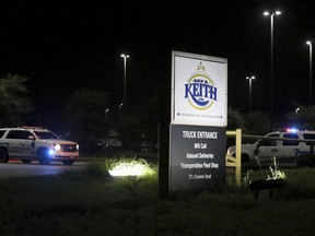 Authorities investigate the scene after a deadly shooting at Ben E. Keith distribution center Monday, Aug. 20, 2018, in Missouri City, Texas. (Yi-Chin Lee/Houston Chronicle via AP)