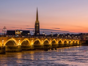 The Pont de Pierre arches across the Garonne River in Bordeaux, France.