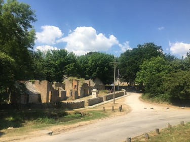 This July 8, 2018 photo, shows a row of ruined cottages at the entrance to Tyneham, in Dorset, England. The tiny village was taken over by the British military in late 1943, to provide more land for training ahead of D-Day. The people were never allowed to return and the houses have slowly fallen apart. It remains in the hands of the Ministry of Defense, which allows tourists to visit most weekends through the year. The village is a poignant reminder of the sacrifices made by ordinary people during World War II.