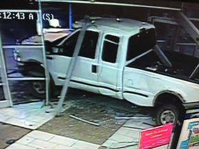 A truck is shown after smashing through the doors of a mall in Red Deer, Alta., in this recent police handout photo taken from surveillance video.