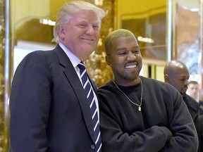 In this Dec. 13, 2016, file photo, Kanye West and then-U.S. President-elect Donald Trump arrive to speak with the press after their meetings at Trump Tower in New York.