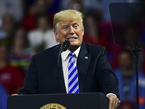 President Donald Trump speaks during a rally Tuesday, Aug. 21, 2018, at the Civic Center in Charleston W.Va.