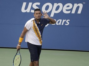 Nick Kyrgios reacts against Pierre-Hugues Herbert during the second round of the U.S. Open, Thursday, Aug. 30, 2018, in New York.
