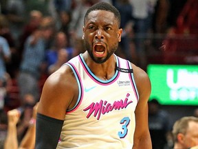 Miami Heat Dwyane Wade screams with the crowd after scoring the winning basket to defeat the Philadelphia 76ers in an NBA basketball game, Tuesday, Feb. 27, 2018 in Miami.