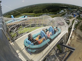 Riders go down the water slide called "Verruckt" at Schlitterbahn Waterpark in Kansas City, Kan. on July 9, 2014. (AP Photo/Charlie Riedel)