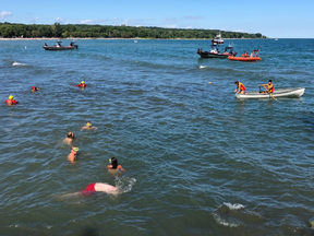 Toronto Police Marine Unit boats, Toronto Fire staff, a Canadian Coast Guard rescue boat, an RCAF helicopter and 10 to 15 lifeguards searched Lake Ontario just off the shore at Woodbine Beach to ensure a group of swimmers who were distress in the water were all accounted for on Friday, Aug. 10, 2018.