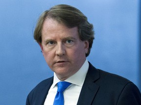 In this Aug. 21, 2018 photo, White House counsel Don McGahn, follows Supreme Court nominee Judge Brett Kavanaugh to meetings on Capitol Hill in Washington.  President Donald Trump is tweeting that his White House counsel, Don McGahn, will be departing in the fall after the Senate confirmation vote for Judge Brett Kavanaugh to serve on the Supreme Court.