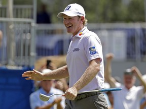 Brandt Snedeker smiles after making a birdie putt on the ninth hole during the first round of the Wyndham Championship in Greensboro, N.C., Thursday, Aug. 16, 2018.